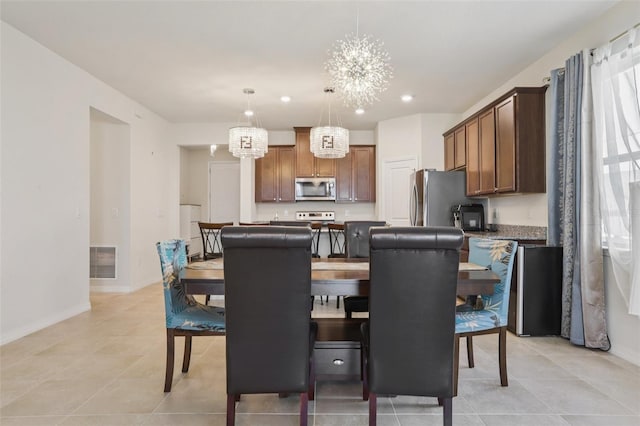 13515 Palmera Vista Dr, Riverview, FL 33579 - dining space featuring a chandelier, recessed lighting, and light tile patterned floors