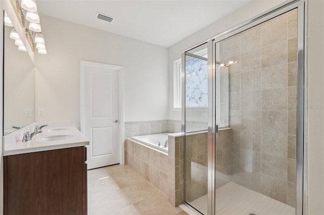 13515 Palmera Vista Dr, Riverview, FL 33579 - bathroom featuring double vanity, a bath, a shower stall, and tile patterned flooring