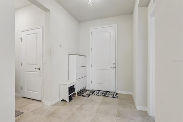 13515 Palmera Vista Dr, Riverview, FL 33579 - entryway featuring baseboards and light tile patterned flooring