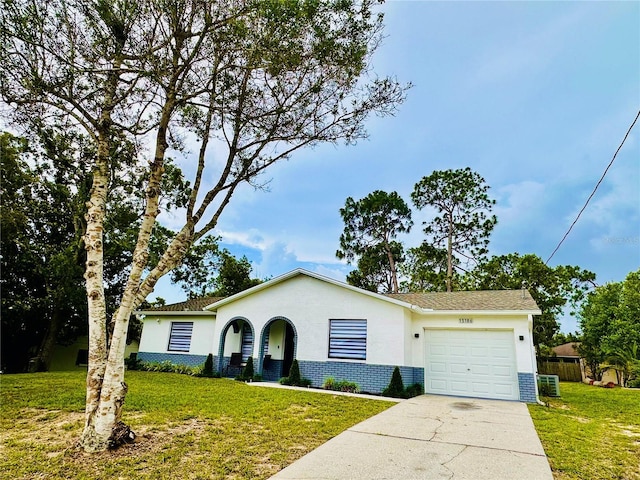 13186 Thrush St, Spring Hill, FL 34609 - single story home with an attached garage, driveway, stucco siding, and brick siding