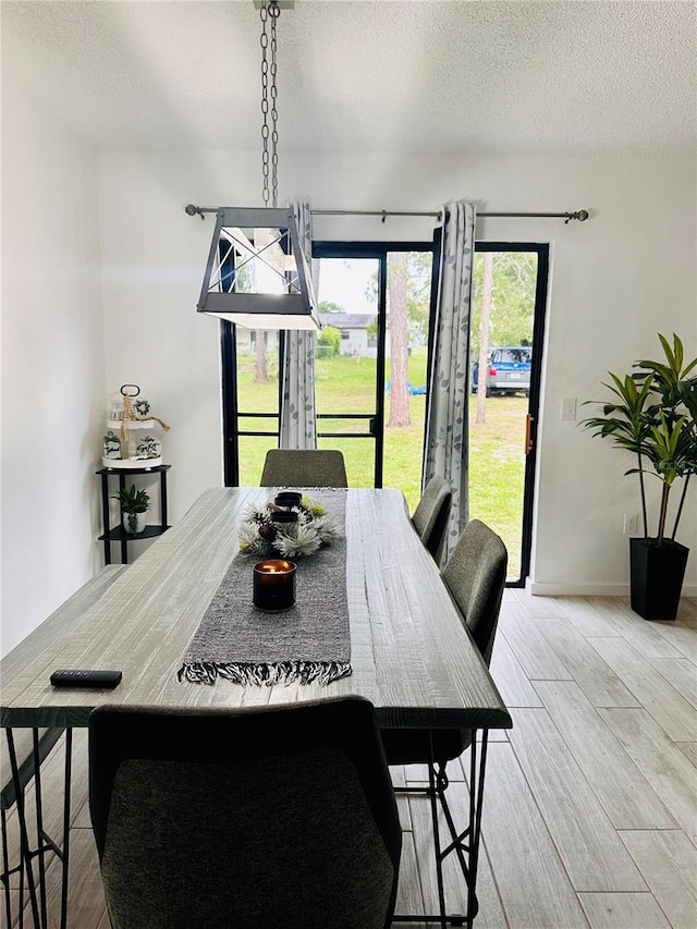 13186 Thrush St, Spring Hill, FL 34609 - dining area with wood finished floors and a textured ceiling