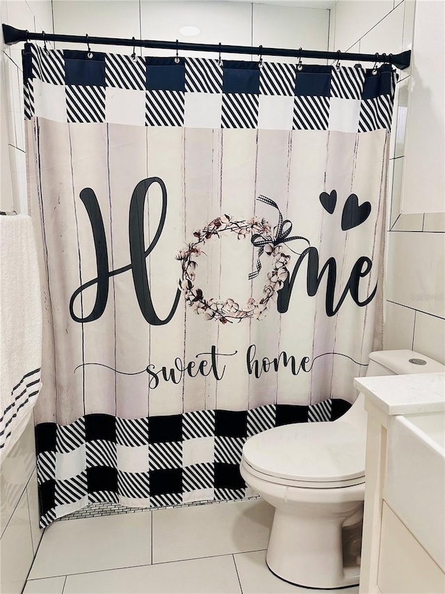13186 Thrush St, Spring Hill, FL 34609 - bathroom with tile walls, tile patterned floors, vanity, and a shower with shower curtain