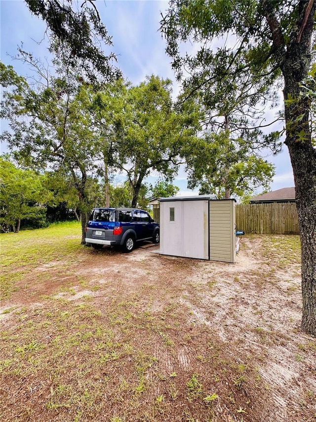 13186 Thrush St, Spring Hill, FL 34609 - view of yard with a storage unit