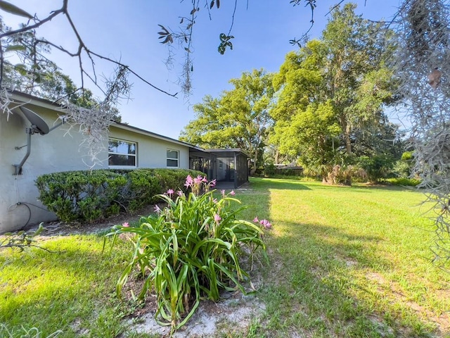 4404 Hickory Branch Ct, Brandon, FL 33511 - view of grassy yard featuring a sunroom