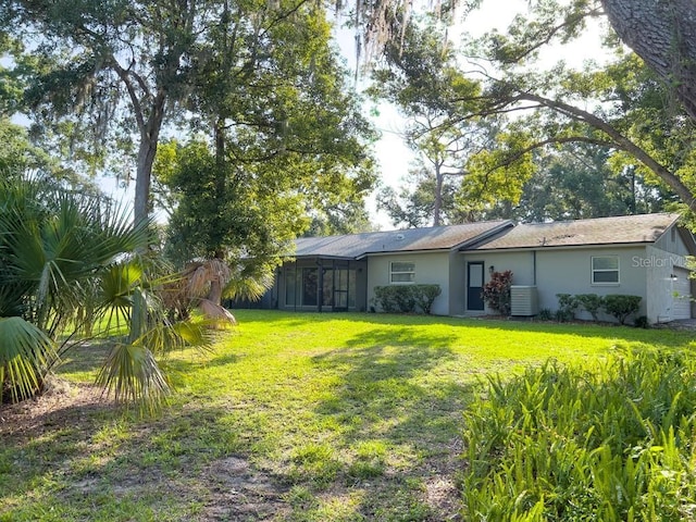 4404 Hickory Branch Ct, Brandon, FL 33511 - view of green lawn featuring a sunroom