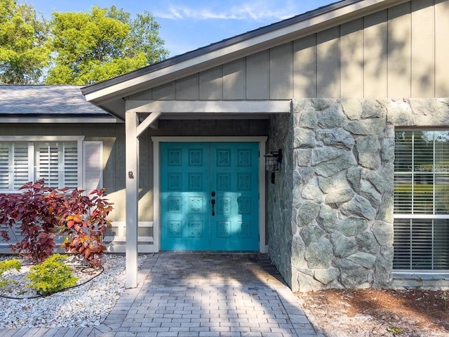 4404 Hickory Branch Ct, Brandon, FL 33511 - property entrance featuring stone siding and board and batten siding