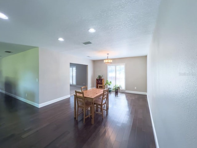 4404 Hickory Branch Ct, Brandon, FL 33511 - dining area featuring a chandelier, dark wood-type flooring, recessed lighting, and a textured ceiling
