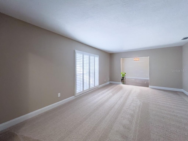 4404 Hickory Branch Ct, Brandon, FL 33511 - carpeted empty room with baseboards and a textured ceiling