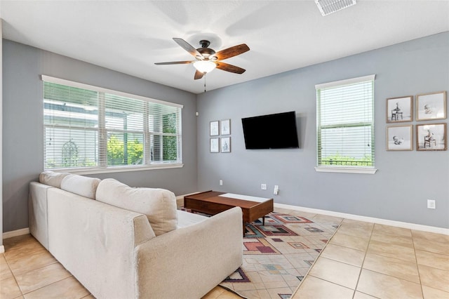 5831 Caldera Ridge Dr, Lithia, FL 33547 - living area with ceiling fan and light tile patterned floors