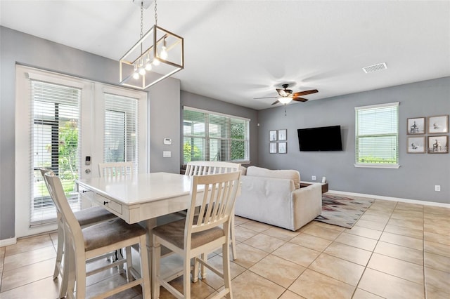 5831 Caldera Ridge Dr, Lithia, FL 33547 - dining room with light tile patterned floors and ceiling fan