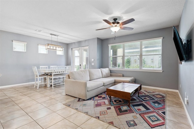 5831 Caldera Ridge Dr, Lithia, FL 33547 - living area with plenty of natural light, ceiling fan, and light tile patterned floors