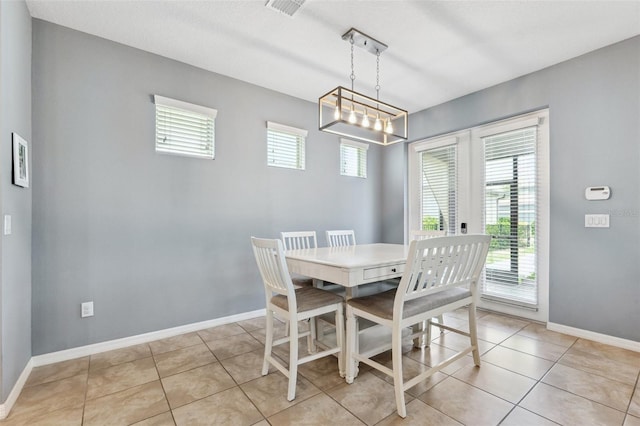 5831 Caldera Ridge Dr, Lithia, FL 33547 - dining space featuring light tile patterned floors and a chandelier