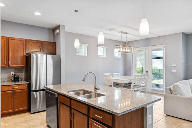 5831 Caldera Ridge Dr, Lithia, FL 33547 - kitchen featuring freestanding refrigerator, dishwasher, light tile patterned flooring, open floor plan, and recessed lighting
