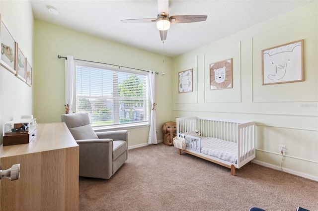 5831 Caldera Ridge Dr, Lithia, FL 33547 - bedroom featuring a nursery area, carpet flooring, and a ceiling fan