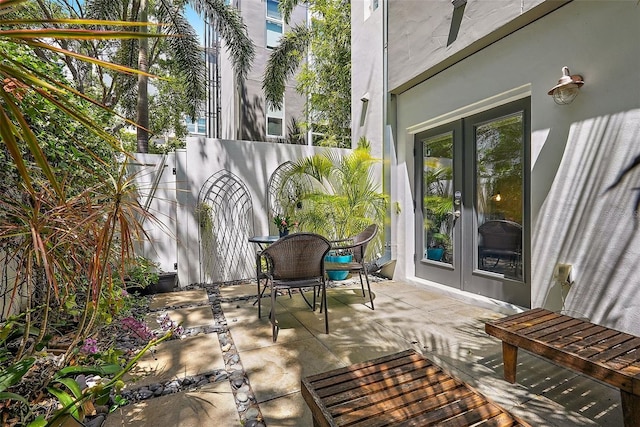 325 5th Ave S Unit 9, Saint Petersburg, FL 33701 - fenced backyard with french doors and a patio area