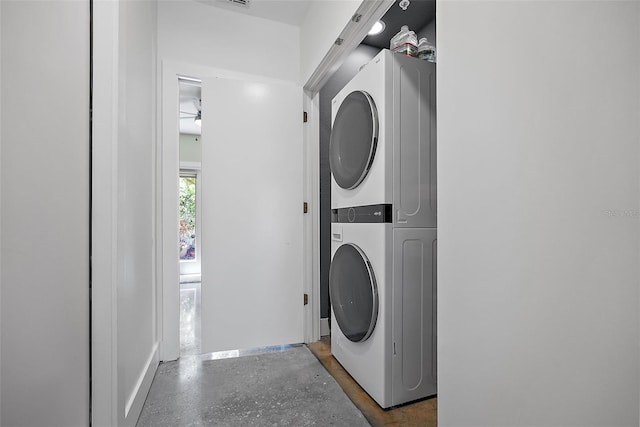 325 5th Ave S Unit 9, Saint Petersburg, FL 33701 - laundry area featuring stacked washer / dryer and ceiling fan