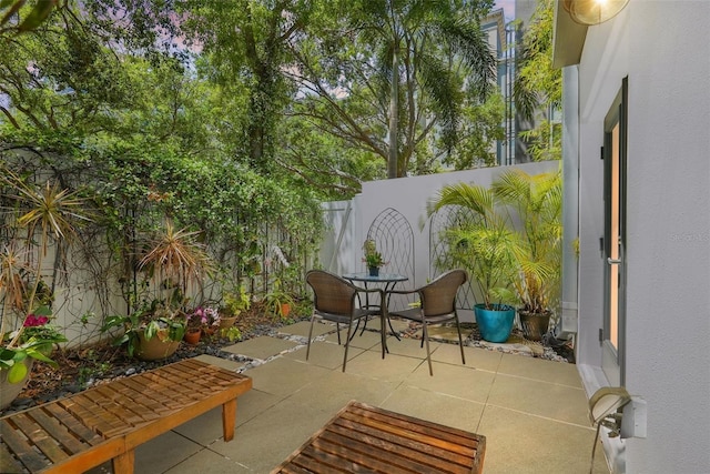 325 5th Ave S Unit 9, Saint Petersburg, FL 33701 - fenced backyard with a patio and outdoor dining space