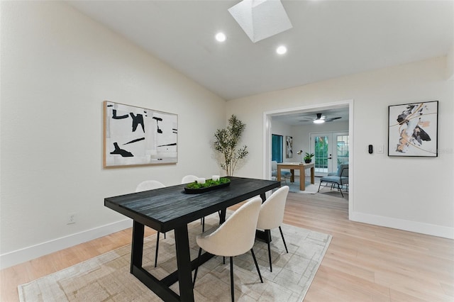 2272 Adam Ct, Palm Harbor, FL 34683 - dining area with a skylight, light wood-type flooring, lofted ceiling, and recessed lighting