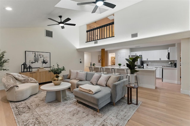2272 Adam Ct, Palm Harbor, FL 34683 - living area with ceiling fan, light wood finished floors, high vaulted ceiling, and recessed lighting