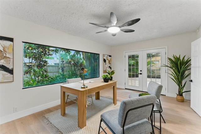 2272 Adam Ct, Palm Harbor, FL 34683 - office space with french doors, light wood finished floors, ceiling fan, and a textured ceiling