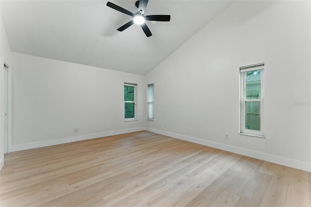 2272 Adam Ct, Palm Harbor, FL 34683 - unfurnished room featuring plenty of natural light, high vaulted ceiling, ceiling fan, and light wood-style flooring