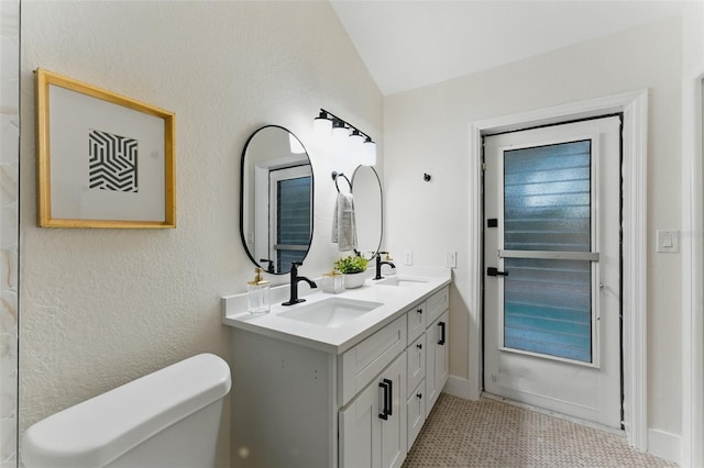 2272 Adam Ct, Palm Harbor, FL 34683 - bathroom with double vanity and lofted ceiling