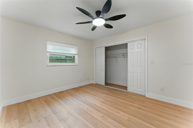 2272 Adam Ct, Palm Harbor, FL 34683 - unfurnished bedroom with light wood finished floors, a closet, and a ceiling fan