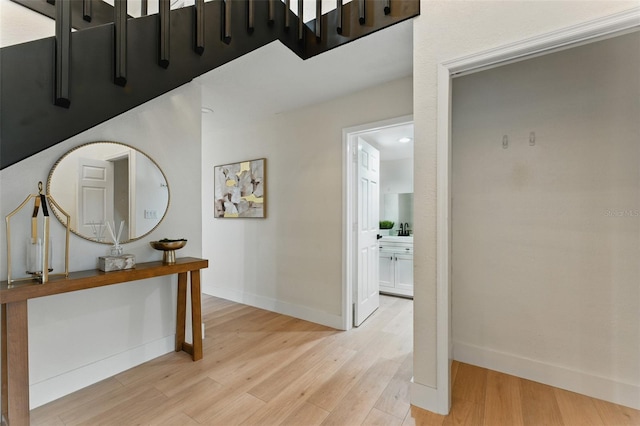 2272 Adam Ct, Palm Harbor, FL 34683 - hall with light wood-style flooring and baseboards