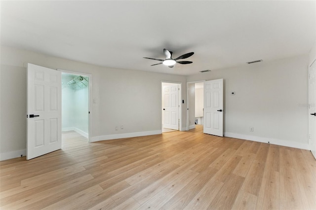 2272 Adam Ct, Palm Harbor, FL 34683 - unfurnished room featuring a ceiling fan and light wood-style flooring