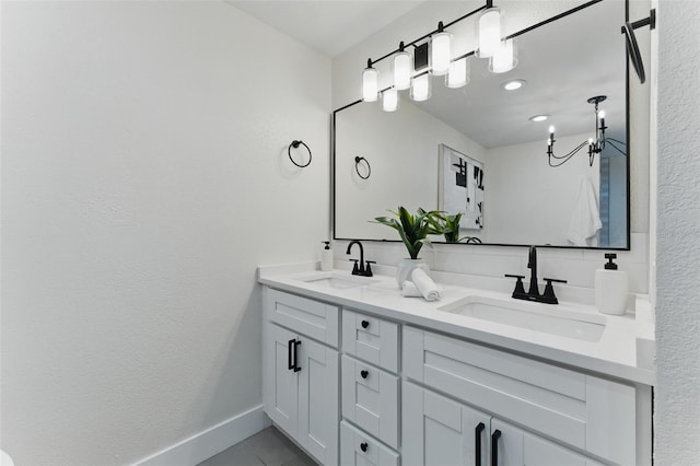 2272 Adam Ct, Palm Harbor, FL 34683 - full bath with double vanity, a chandelier, and tile patterned flooring