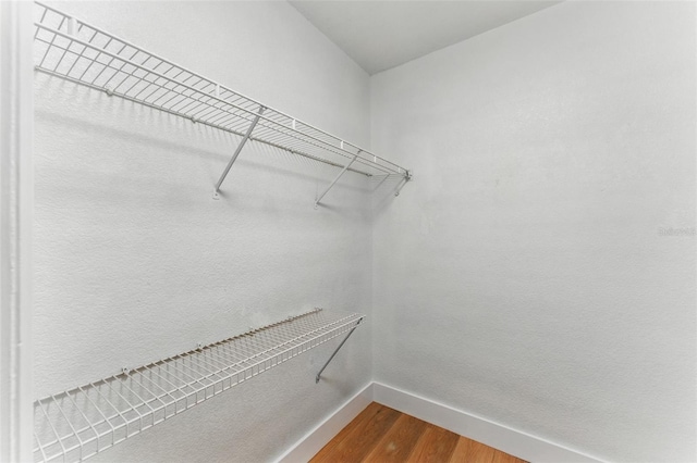 2272 Adam Ct, Palm Harbor, FL 34683 - spacious closet featuring dark wood-type flooring
