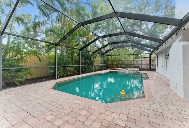 2272 Adam Ct, Palm Harbor, FL 34683 - view of pool with a fenced backyard, a patio, a pool with connected hot tub, and glass enclosure