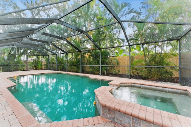 2272 Adam Ct, Palm Harbor, FL 34683 - view of pool with a pool with connected hot tub and glass enclosure