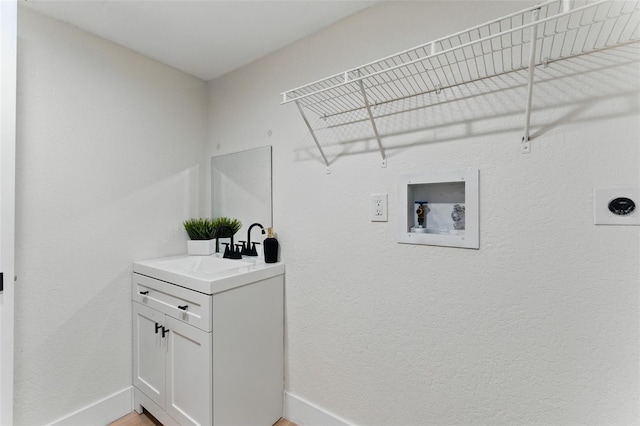 2272 Adam Ct, Palm Harbor, FL 34683 - laundry area with electric dryer hookup, washer hookup, and cabinet space
