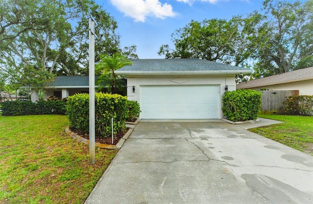 2272 Adam Ct, Palm Harbor, FL 34683 - view of front facade featuring driveway, stucco siding, a garage, and roof with shingles