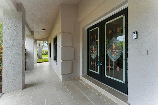 2272 Adam Ct, Palm Harbor, FL 34683 - property entrance with french doors and stucco siding