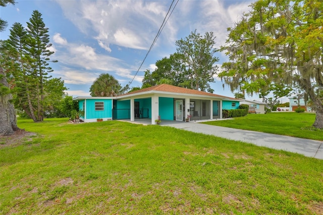 301 Carlyle Blvd, Ruskin, FL 33570 - view of front of property with driveway, a front lawn, and an attached carport