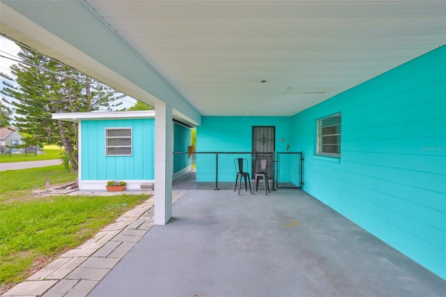 301 Carlyle Blvd, Ruskin, FL 33570 - view of patio featuring a carport