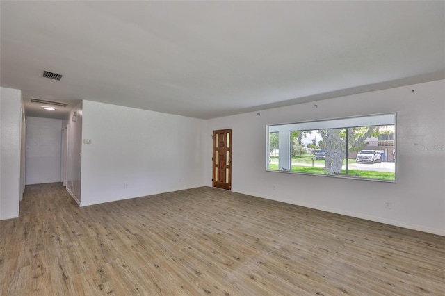 301 Carlyle Blvd, Ruskin, FL 33570 - spare room featuring wood finished floors and baseboards