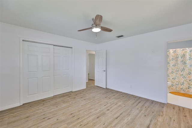 301 Carlyle Blvd, Ruskin, FL 33570 - unfurnished bedroom featuring light wood-style floors, a closet, and a ceiling fan