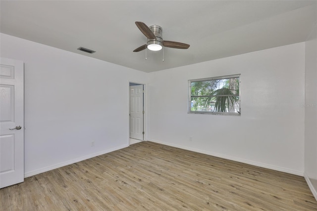 301 Carlyle Blvd, Ruskin, FL 33570 - empty room featuring light wood finished floors and a ceiling fan
