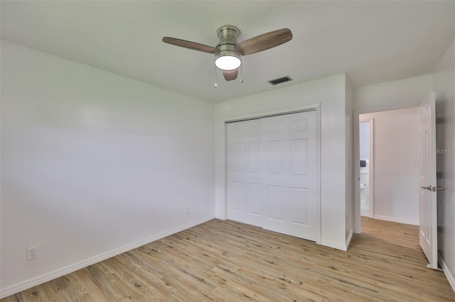 301 Carlyle Blvd, Ruskin, FL 33570 - unfurnished bedroom with light wood-type flooring, a closet, and ceiling fan
