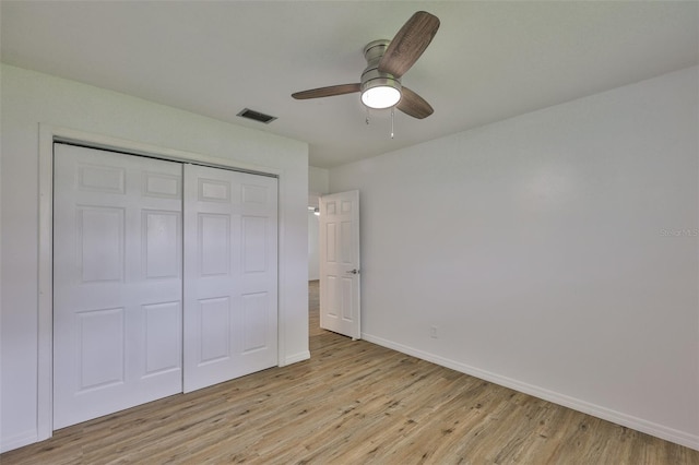 301 Carlyle Blvd, Ruskin, FL 33570 - unfurnished bedroom featuring light wood-style flooring, a closet, and ceiling fan