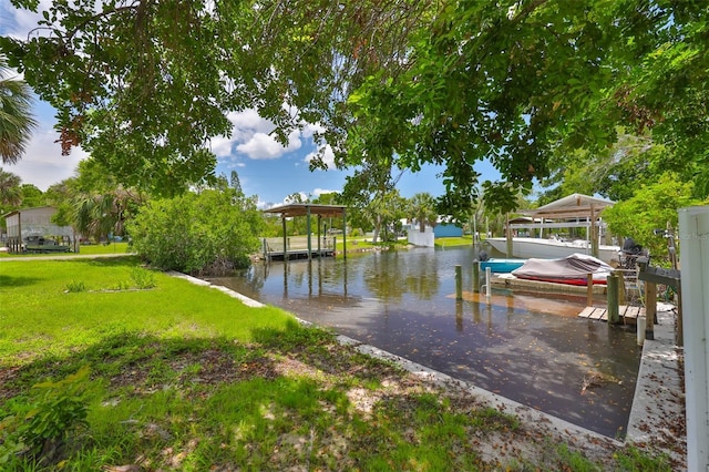 301 Carlyle Blvd, Ruskin, FL 33570 - dock area featuring boat lift, a lawn, and a water view