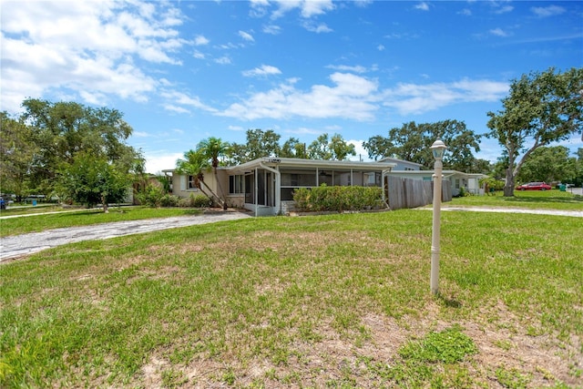 11896 104th Ln, Largo, FL 33773 - view of front of house with a sunroom and driveway