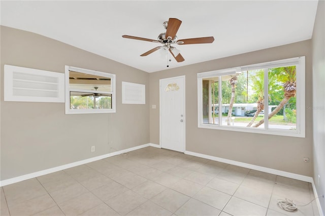 11896 104th Ln, Largo, FL 33773 - empty room featuring baseboards and a ceiling fan