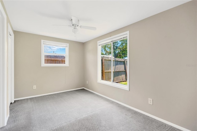11896 104th Ln, Largo, FL 33773 - spare room featuring carpet and ceiling fan