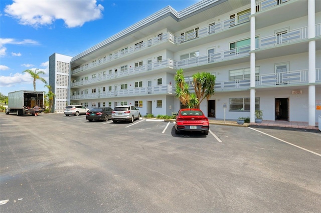 3018 59th St S Unit 405, Gulfport, FL 33707 - view of building exterior with uncovered parking