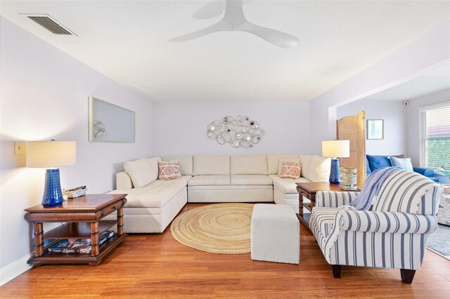 3018 59th St S Unit 405, Gulfport, FL 33707 - living room with wood finished floors and a ceiling fan