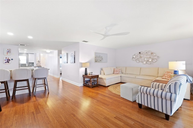 3018 59th St S Unit 405, Gulfport, FL 33707 - living room featuring wood finished floors and a ceiling fan